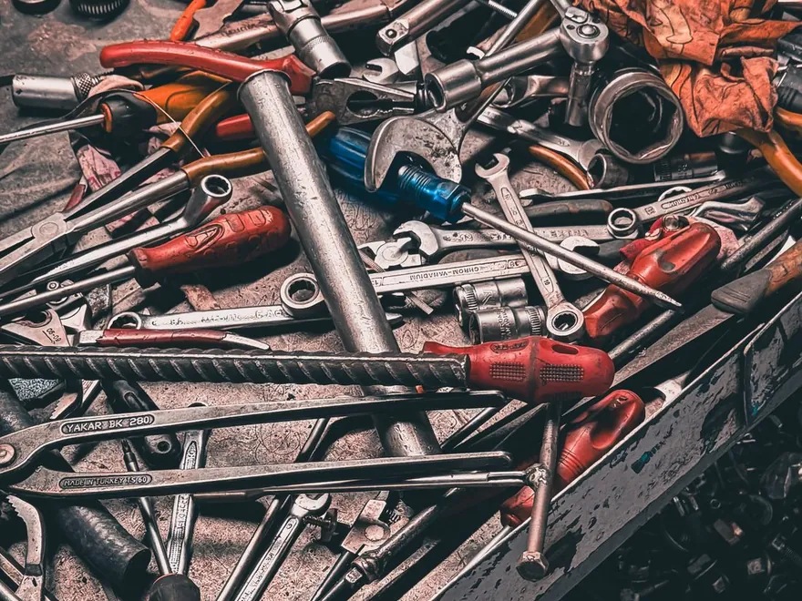 An assortment of hand tools seen from above